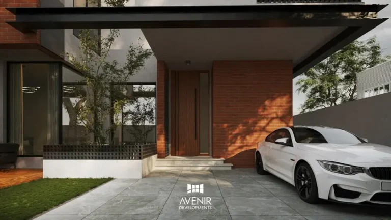 Car porch and entrance of the DHA Phase 6 house under a flat projecting roof