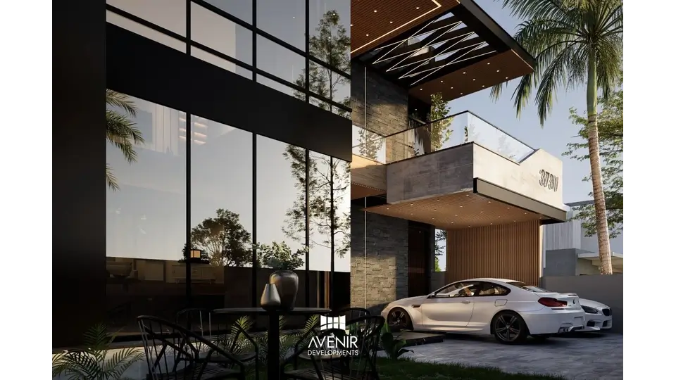 Car porch and glazed double-height entrance of the 373-V house in DHA Phase 8 Lahore