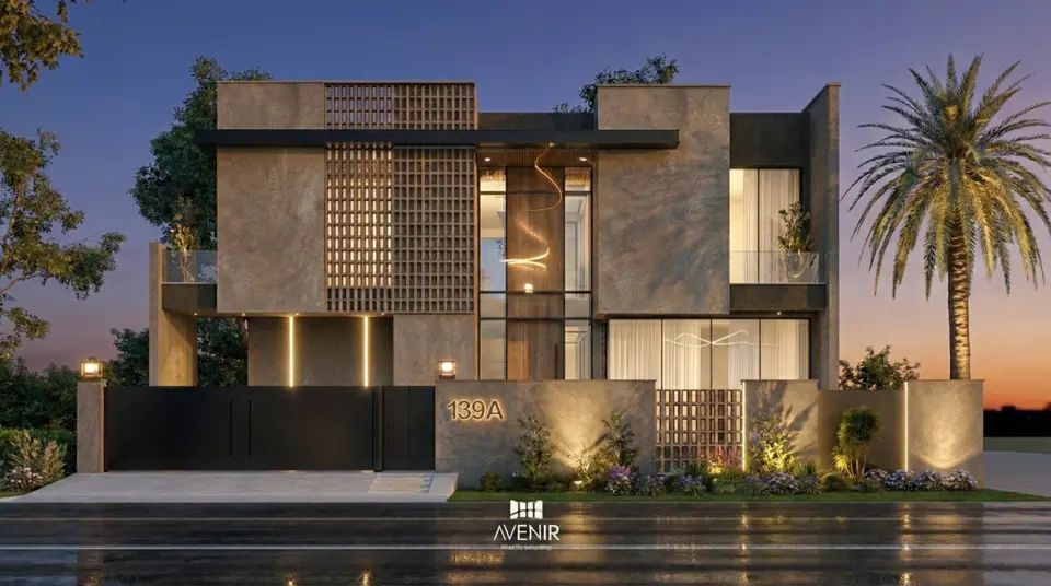 Dusk render of a 1 Kanal house in Lake City Lahore with stone-clad volumes, a brick jali screen, a glazed stair tower and lit planters