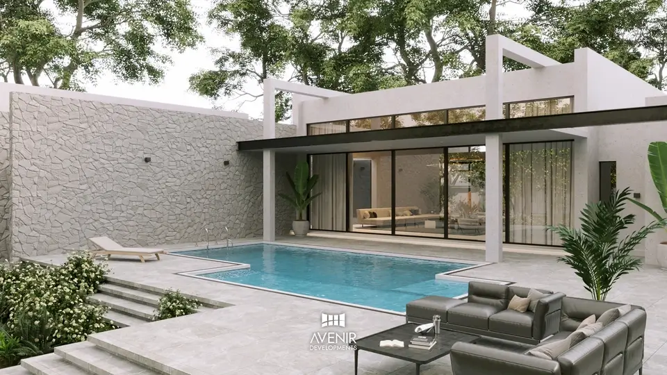Pool terrace opening off the living rooms of the Raiwind Road farmhouse, with a stone garden wall